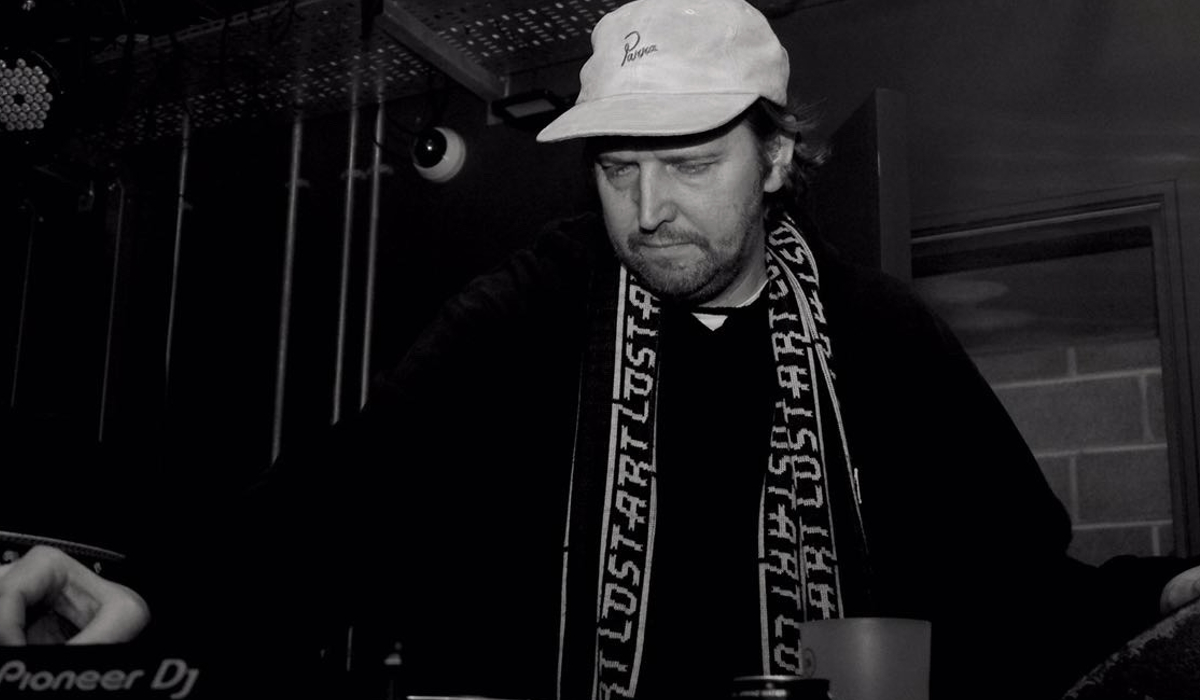 A black and white image of Paddy Quinn DJ'ing.