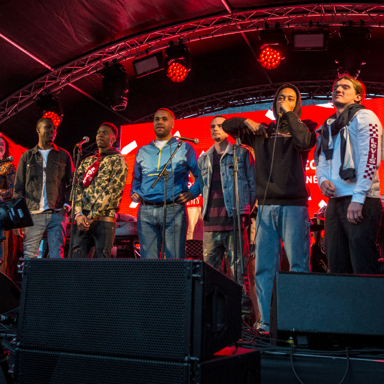 Loyle Carner performing at an outdoor stage at Liverpool Sound City 2019.