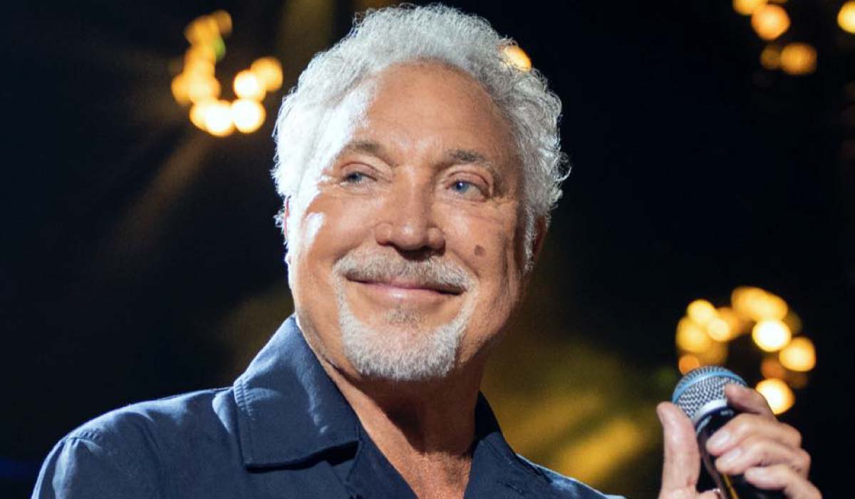 tom jones on stage with microphone