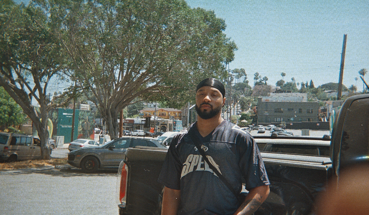 A flm photograph of a person outside on a sunny day