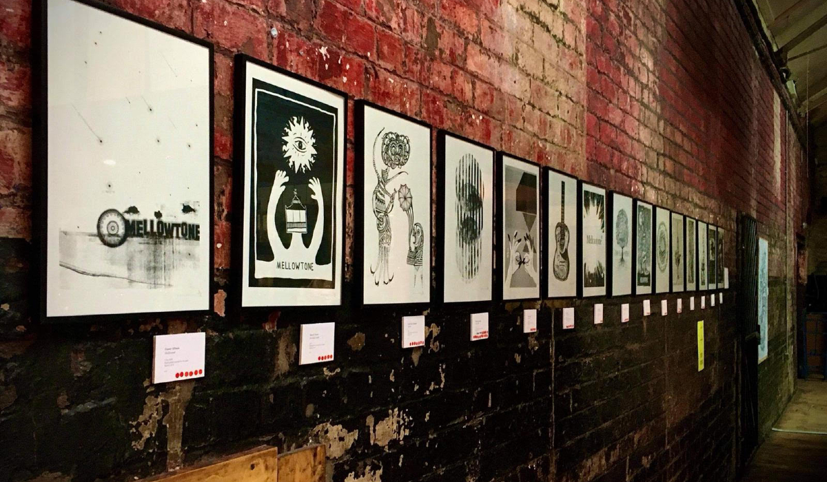 An image of different art prints presented on a wall.