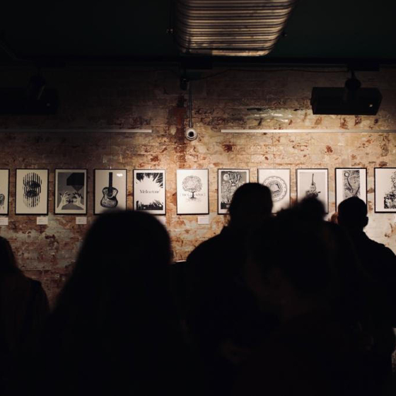 An image of different art prints presented on a wall.