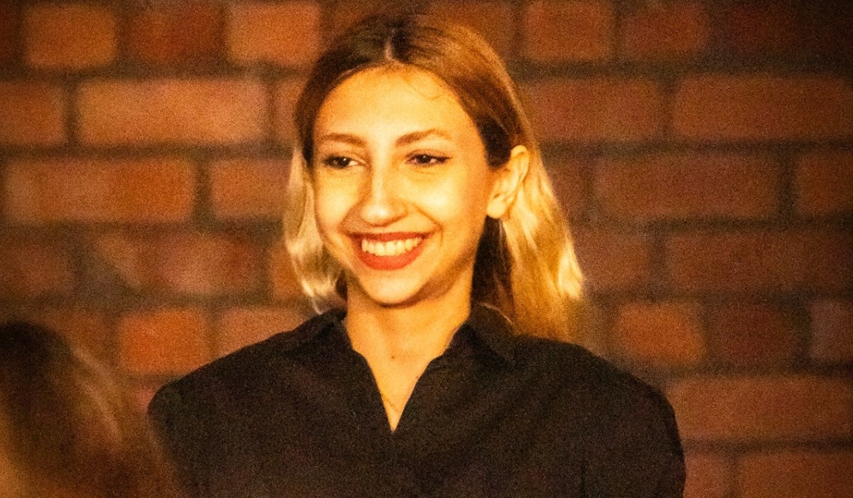 An image of a woman smiling at the camera